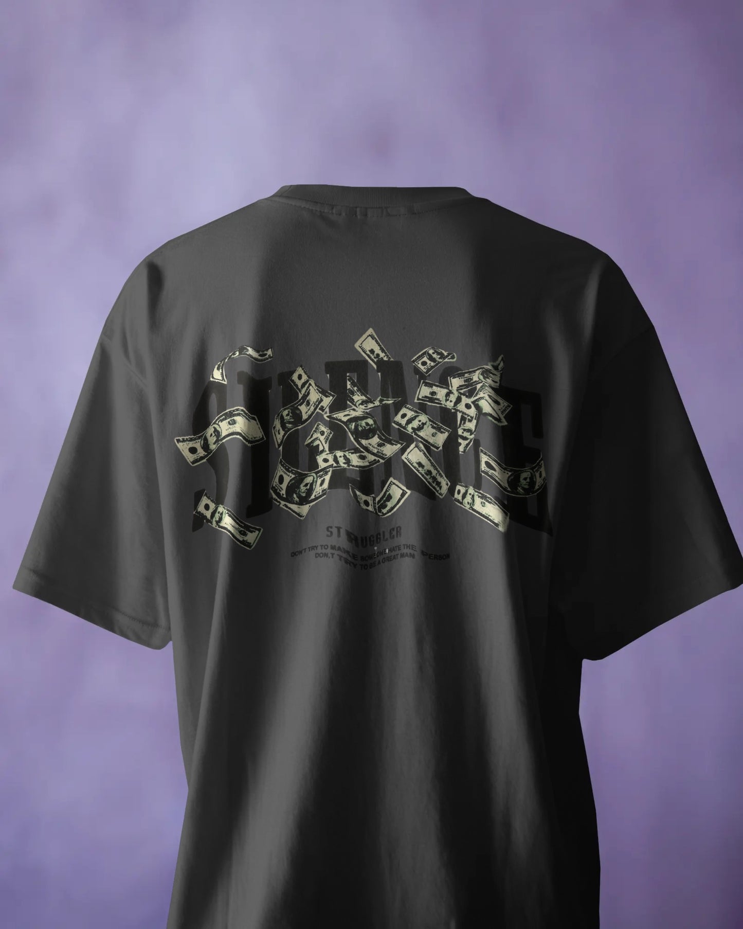 Black t-shirt with a graphic design on the back against a purple background