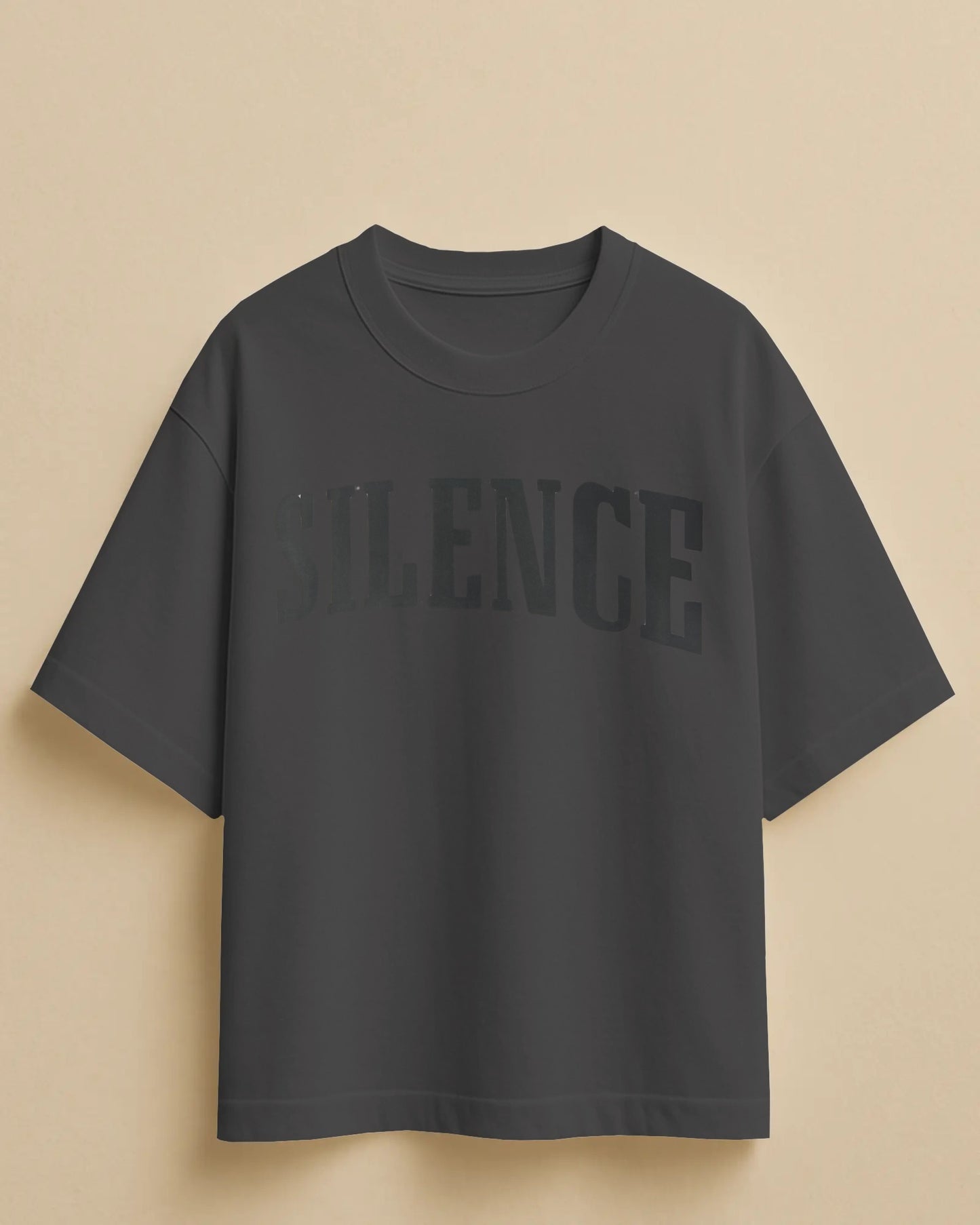 Black t-shirt with 'VIBRANCE' text on a beige background